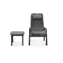 Fårskinnsfåtölj med fotpall - Frank + Möbeltassar