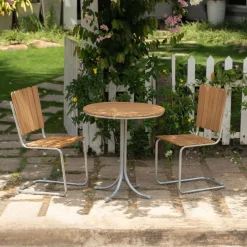 Teakstol med galvat stål, stapelbar - Möllan + Textilskydd för utemöbler